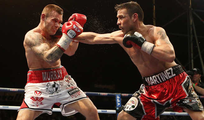 Despite rain and Martin Murray's fists, Sergio Martinez held on to his WBC middleweight title.